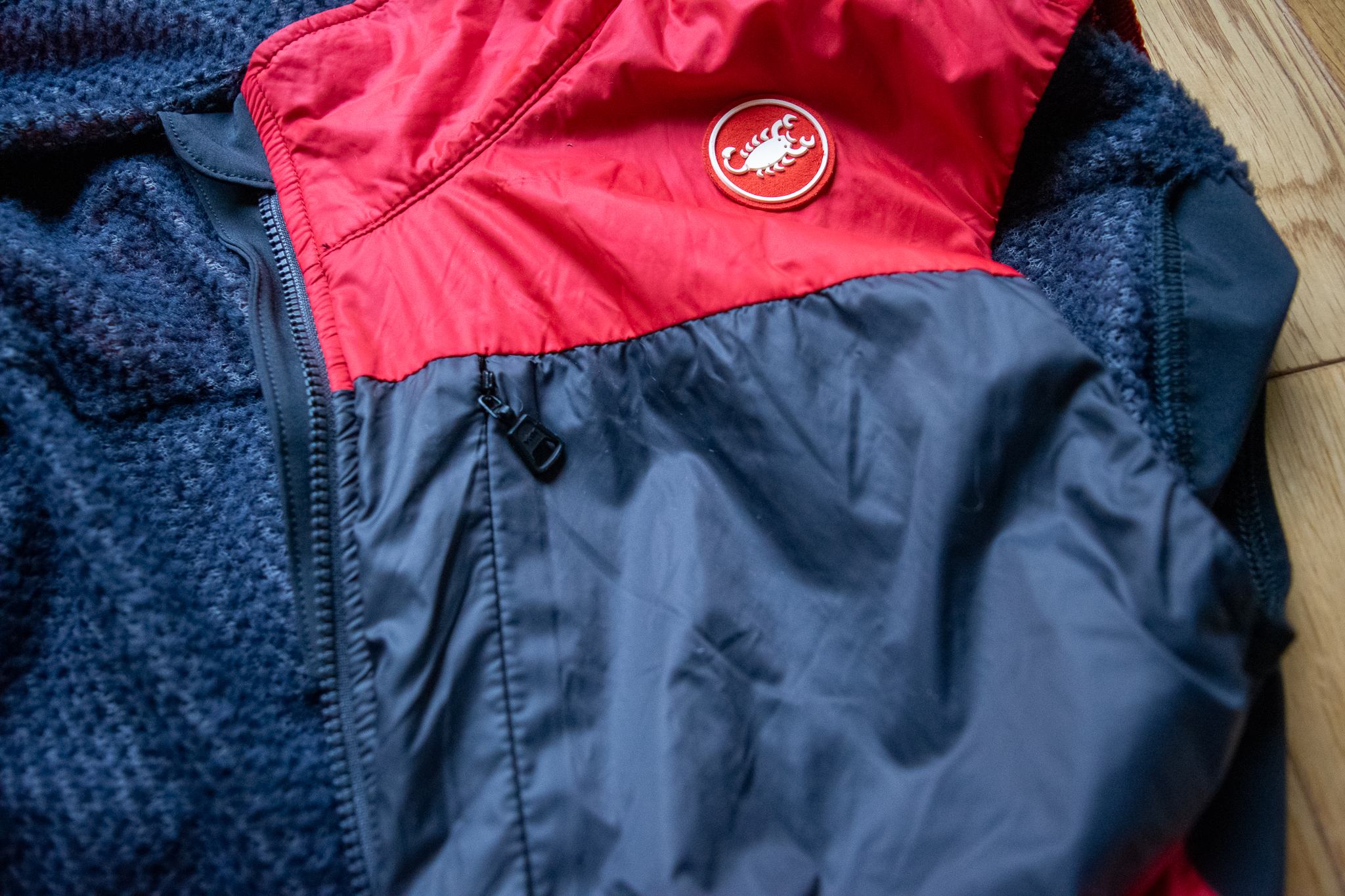 A Castelli Unlimited Puffy vest closeup showing the zipper