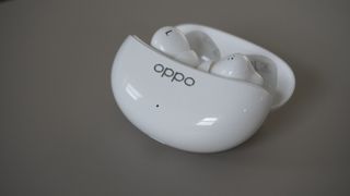 The Oppo Enco Air 3 Pro wireless earbuds on a grey background