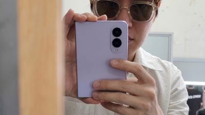 Samsung Galaxy Z Fold 8 held by J-Hope from BTS