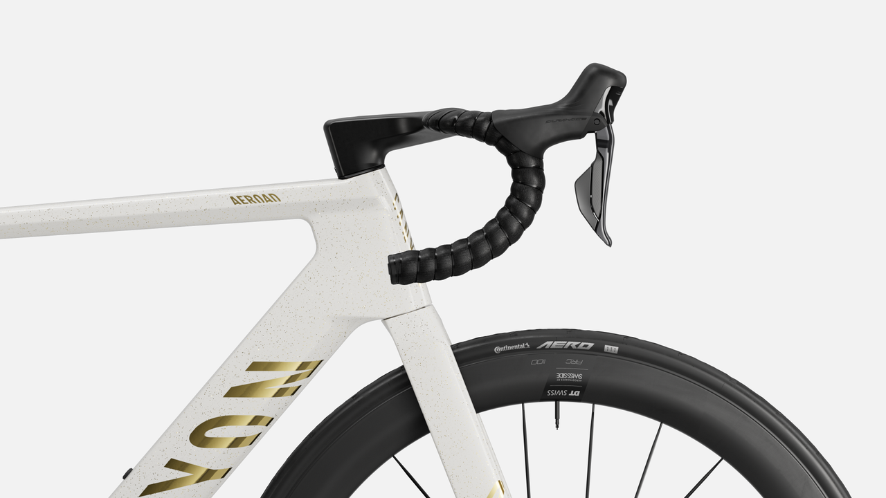 A canyon bike is shown side on cropped in on the handlebar