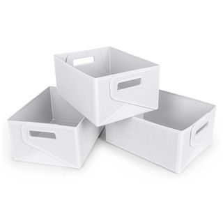 Set of three white collapsible bins piled up