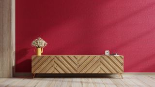 Living room with warm-hued burgundy wall