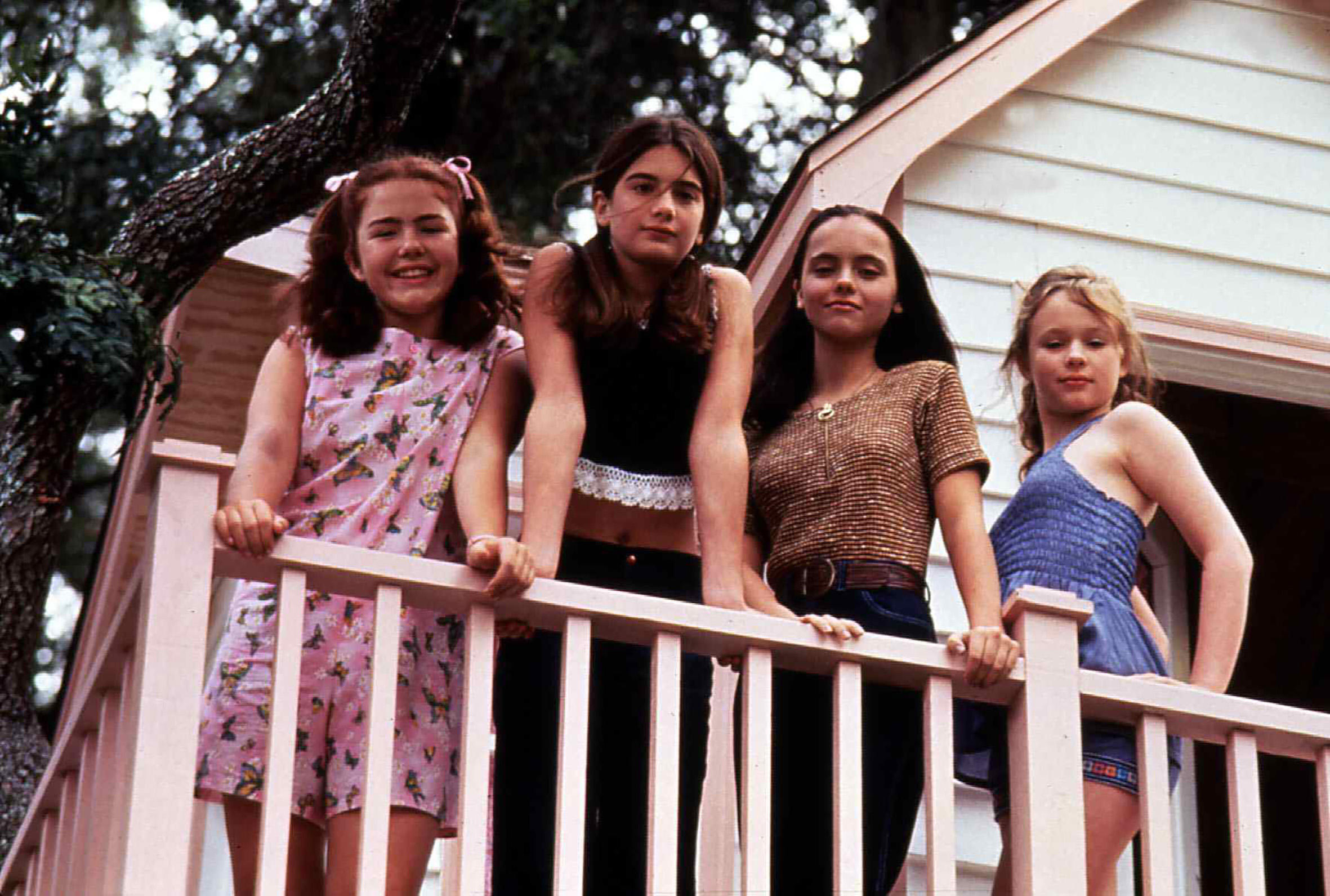 Ashleigh Aston Moore, Gaby Hoffman, Christina Ricci and Thora Birch star in 'Now and Then' standing on a tree horse porch in 70s era clothing