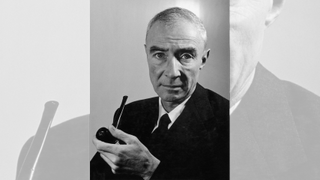 A portrait of J. Robert Oppenheimer holding a pipe