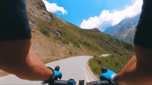 AI created video. POV of biker riding down mountain road