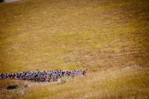 Riders make their way through the golden Utah hills.