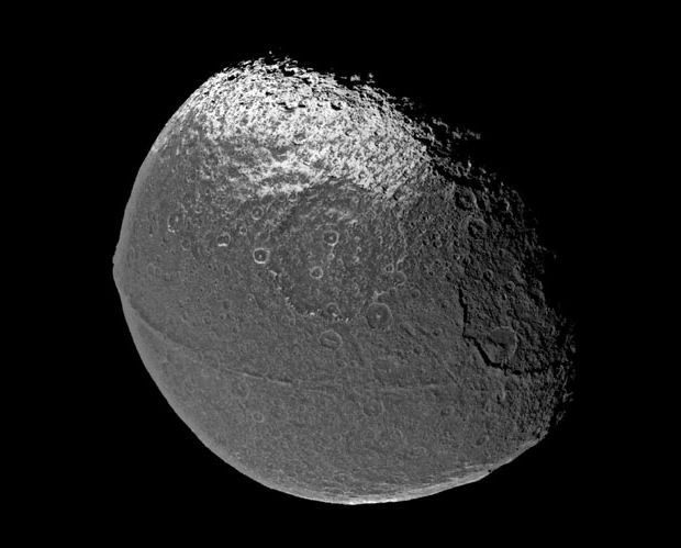 Mystery of Saturn's Walnut Moon Cracked? | Space