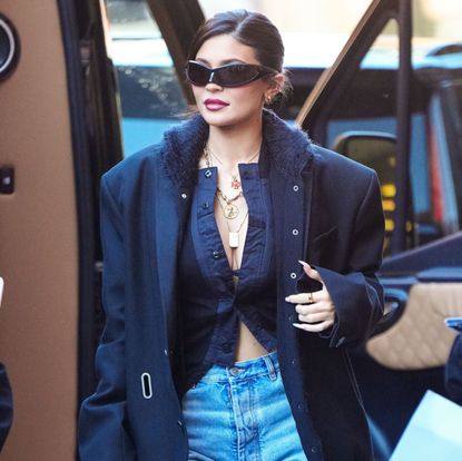 Kylie Jenner black sweater blue jeans