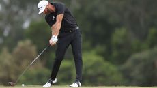 Dustin Johnson at impact hitting a drive