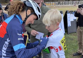 Jolanda Neff signs an autograph after winning 2022 North Carolina Grand Prix cyclocross race