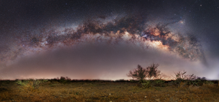 The Milky Way galaxy arches across the night sky in this panoramic image captured by photographer Matt Smith in July. This image is actually a composite of roughly 80 images that have been stitched together to create a complete view of the Milky Way, incl