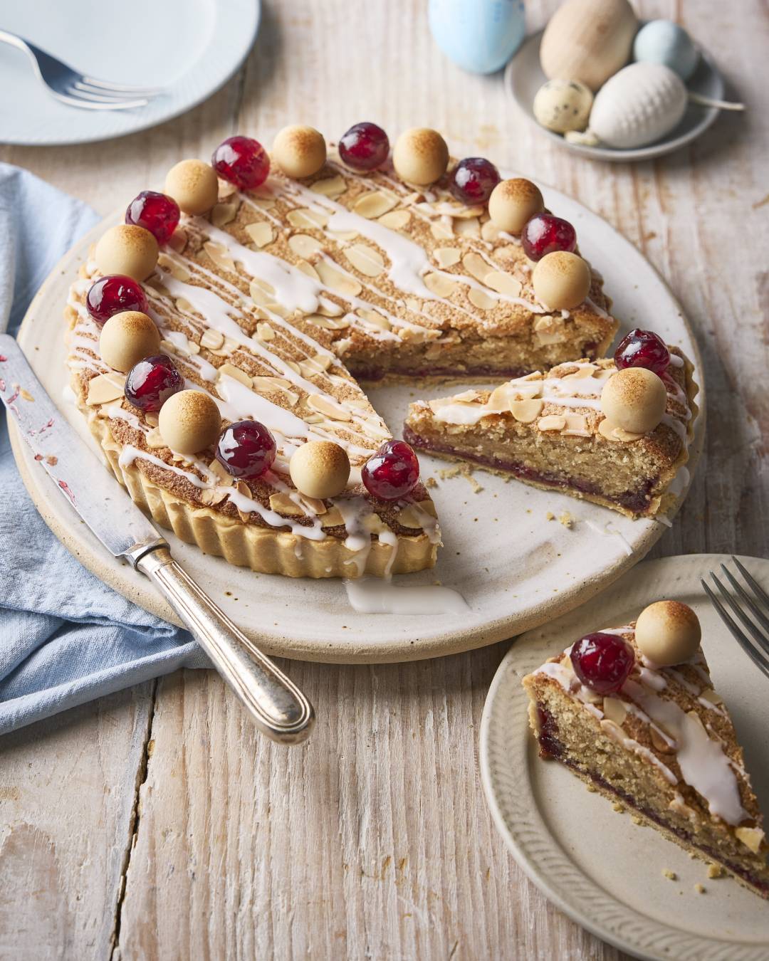 Bakewell simnel tart on plate with slice out