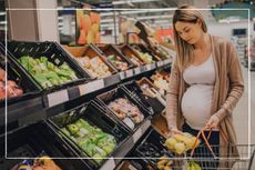mum-to-be shopping in supermarket