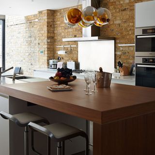 basement kitchen with industrial accessories and lighting