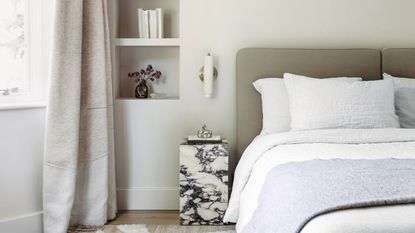 Neutral bedroom with marble bedside table