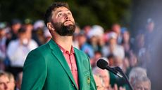 Jon Rahm looks to the sky after winning the Masters