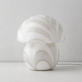 A white mushroom lamp with a swirling pattern