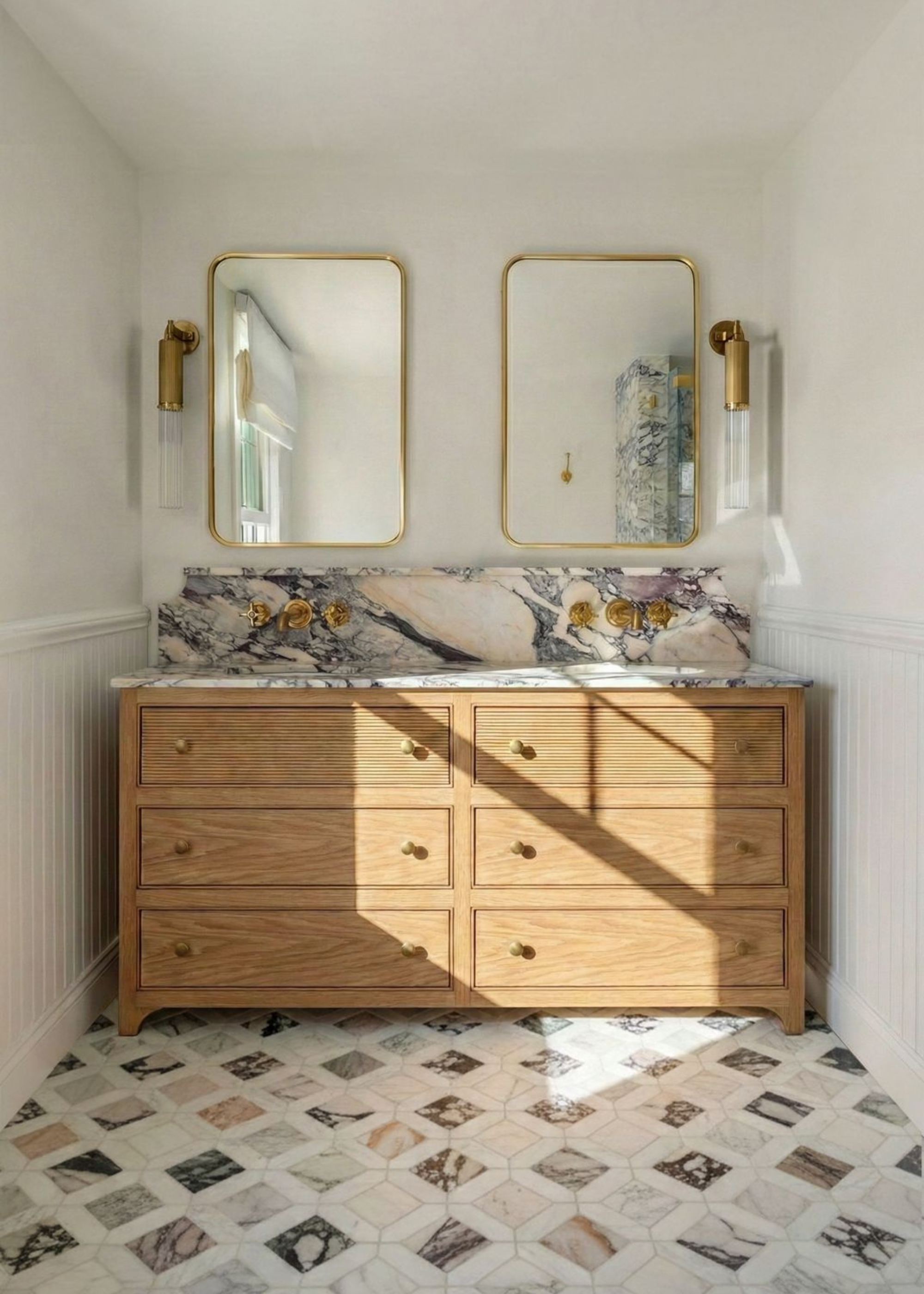 Mosaic marble floor tiles in a bathroom with a marble topped wooden dresser with double sinks
