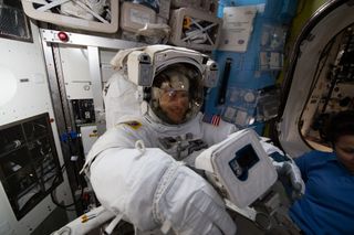 NASA astronaut Christina Koch gets fitted in her spacesuit ahead of her first spacewalk on March 29, 2019.