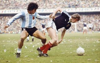 Scotland's Kenny Dalglish holds off Argentina's Americo Gallego during a friendly in Buenos Aires in 1977.