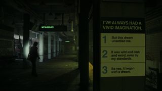 Alan Wake 2 screenshot showing Alan Wake exploring the subway tunnels with dream logic scrawled on the walls