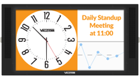An image of a clock announcing a meeting on a touchpanel display. 