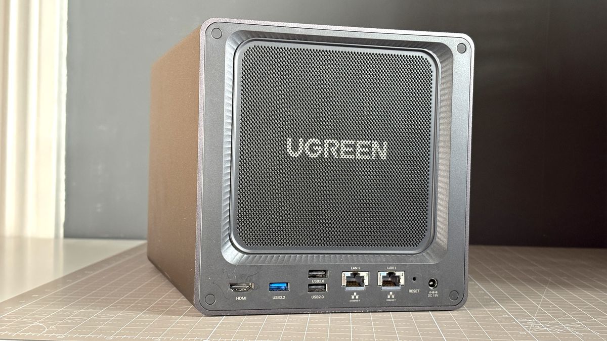 UGreen NASync DXP4800 Pro on a desk with multiple HDDs installed.