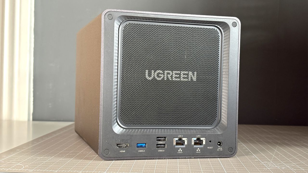 UGreen NASync DXP4800 Pro on a desk with multiple HDDs installed.