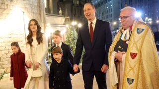 Princess Charlotte of Wales, Catherine, Princess of Wales, Prince Louis of Wales, Prince George of Wales, Prince William, Prince of Wales and The Dean of Westminster Abbey, The Very Reverend Dr David Hoyle attend The "Together At Christmas" Carol Service at Westminster Abbey on December 08, 2023