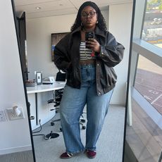 chichi wears good american jeans while taking mirror selfies