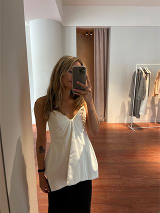 Eliza Huber in a white satin strapless corset at the Carven store in Paris.