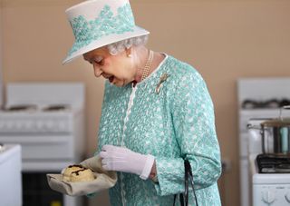 Queen Elizabeth II with some scones