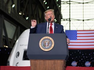 President Donald Trump speaks inside the Vehicle Assembly Building following the launch of a SpaceX Falcon 9 rocket carrying the company's Crew Dragon spacecraft on NASA’s SpaceX Demo-2 mission with NASA astronauts Robert Behnken and Douglas Hurley onboard, Saturday, May 30, 2020, at NASA’s Kennedy Space Center in Florida. 