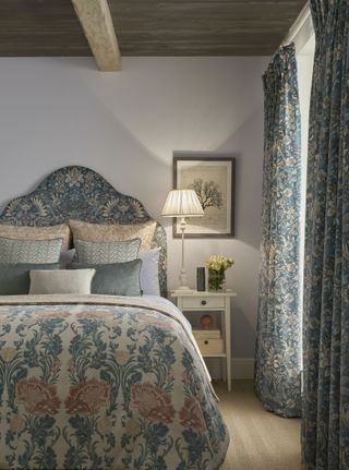 country bedroom with coordinating headboard and curtains