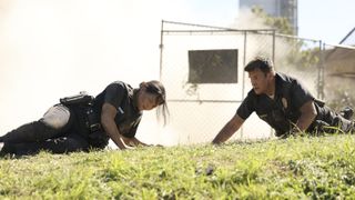 Melissa O'Neil and Nathan Fillion as Chen and Nolan in danger on The Rookie