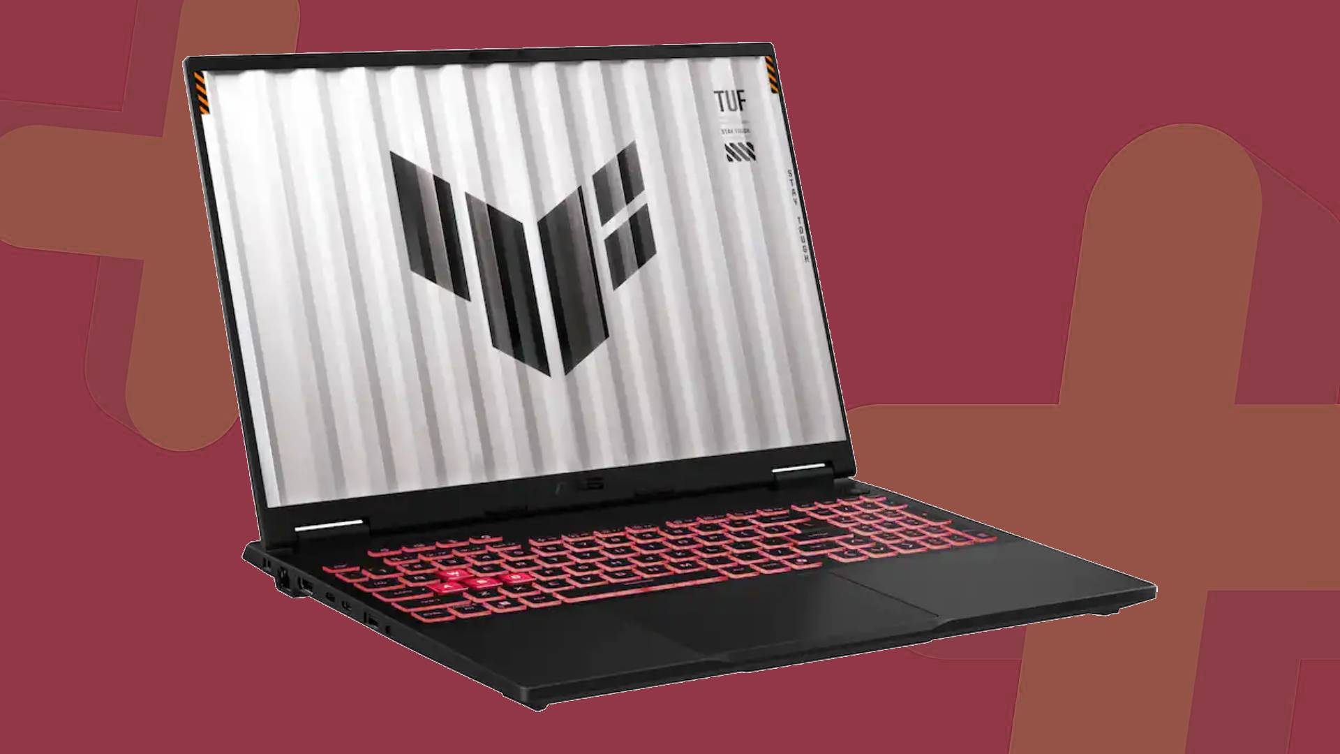 Asus TUF A16 laptop with orange backdrop.