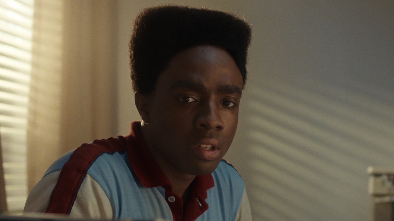 Lucas at Max's hospital bed in Stranger Things Season 5