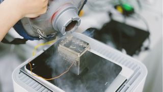 Liquid nitrogen being poured on the back of an iPad Pro with M4 chip