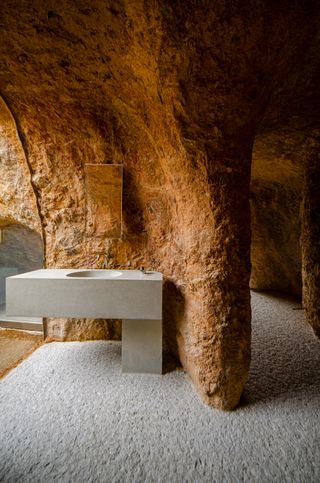 Wash basin within cave-like house and restaurant by Junya Ishigami in Japan