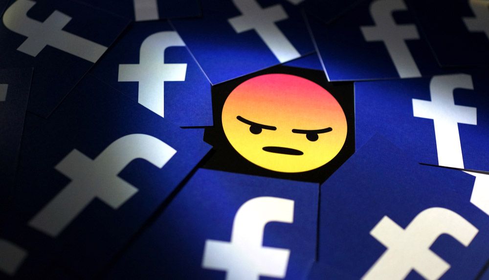 An angry emoji surrounded by multiple examples of the Facebook logo.