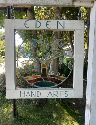 The signage of Dennis-based jewelry boutique and home to the Cape Cod bracelet, Eden Hand Arts.