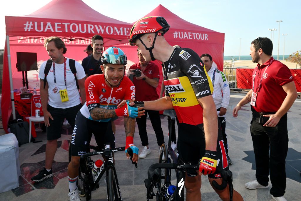 Caleb Ewan and Tim Merlier shake hands after the Belgian was deemed the winner of stage 1 of the UAE Tour