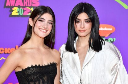 Charli D'Amelio and Dixie D'Amelio attend Nickelodeon's Kids' Choice Awards at Barker Hangar on March 13, 2021 in Santa Monica, California