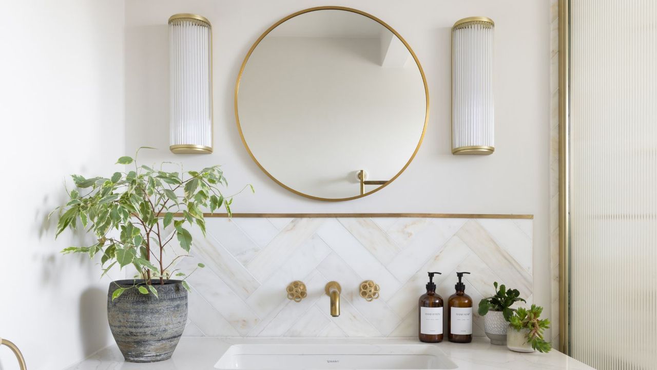 A white and marble tile bathroom vanity area