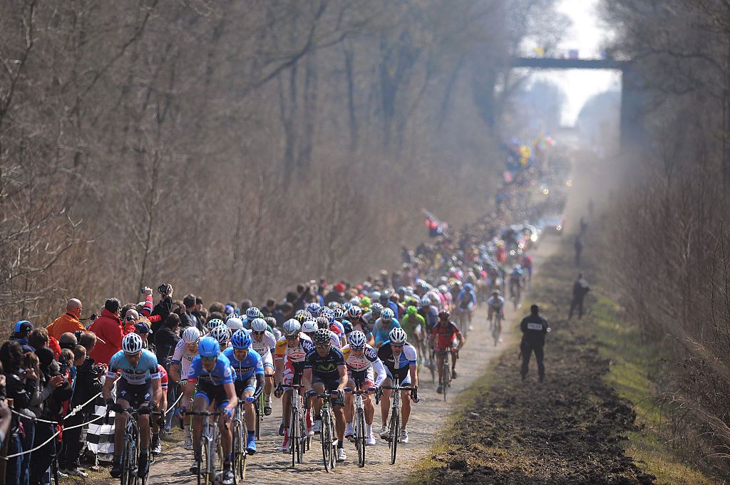 The peloton rides the Trouée d&#039;Arenberg in Paris-Roubaix