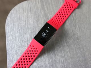 Fitbit Charge 3 with red sport band