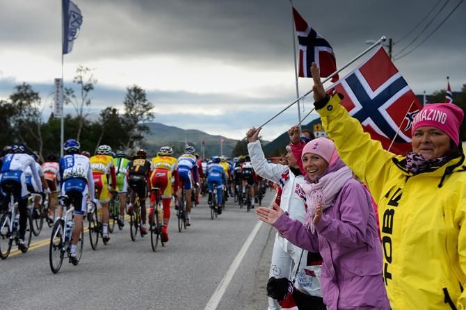 Fans cheer on the peloton