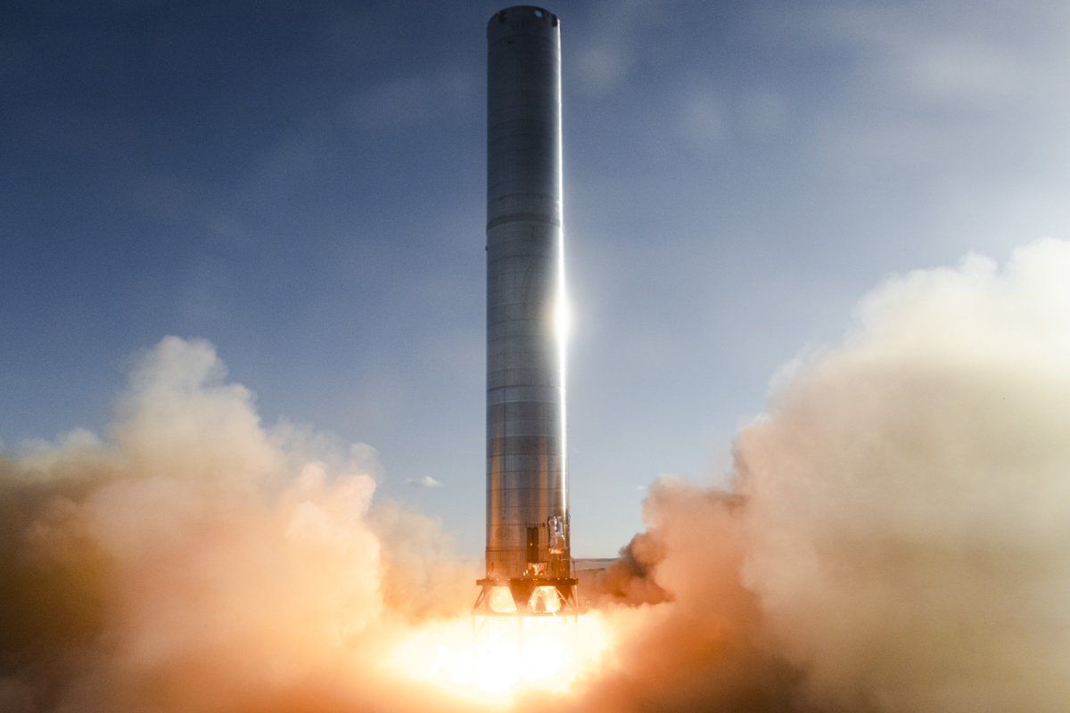 SpaceX fired up the massive booster rocket for its new Starship spacecraft Monday night (July 19) in a short first-of-its-kind test for the company's 