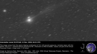 A bright, fuzzy point of light representing a comet's central coma is visible shining to the lower left of an image, with a faint tail extending to the upper left lof the screen. Points of light representing stars are visible in the black sky beyond.