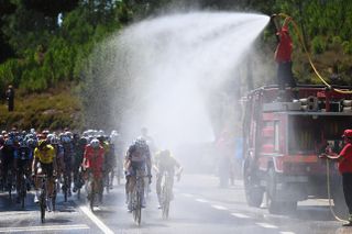 Peloton hosed by water at the Vuelta a España